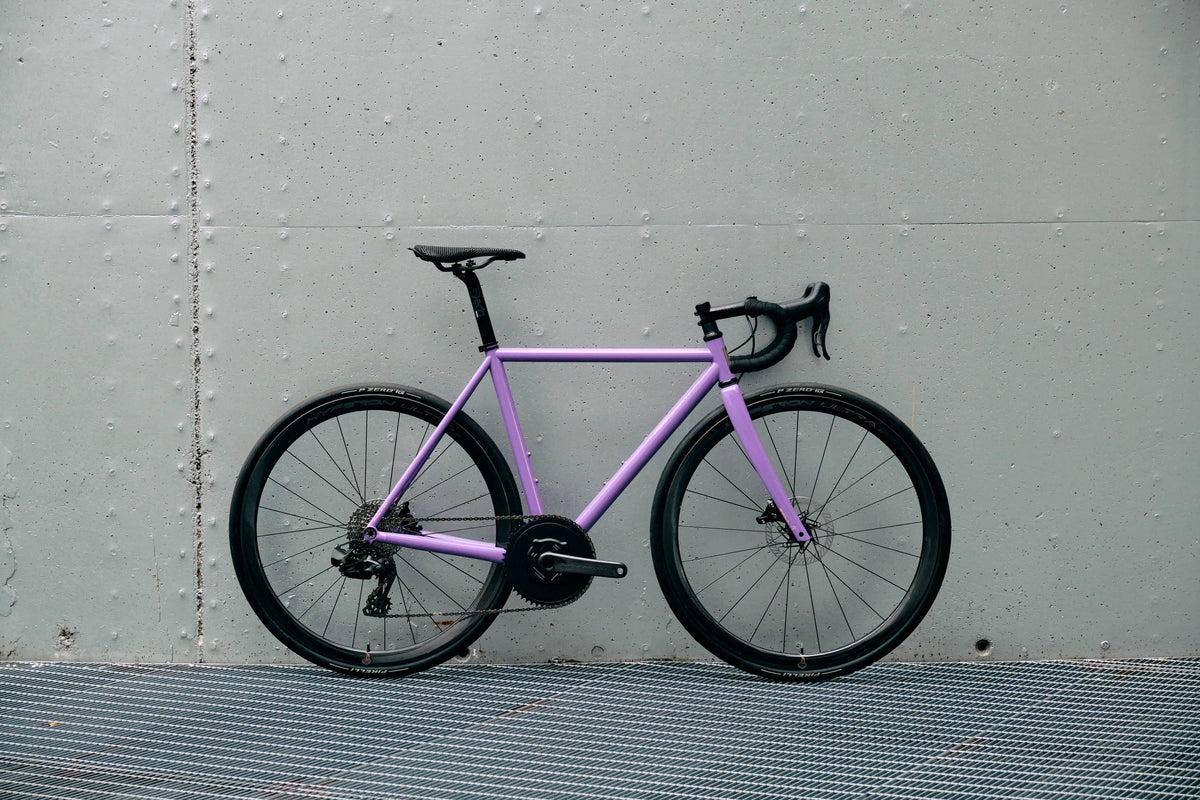 Drive side view of the Dario Pegoretti Round stainless steel complete bicycle with Campagnolo Super Record 13-speed and Hyperon Ultra wheels, custom built by Cicli Corsa.