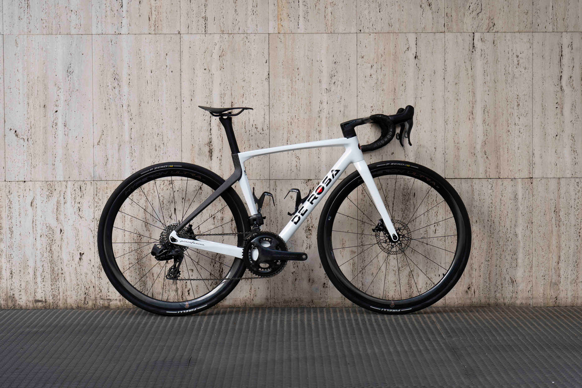 Drive side view of the De Rosa 70 White complete bicycle with Campagnolo Super Record 13-speed and Hyperon Ultra wheels, custom built by Cicli Corsa.