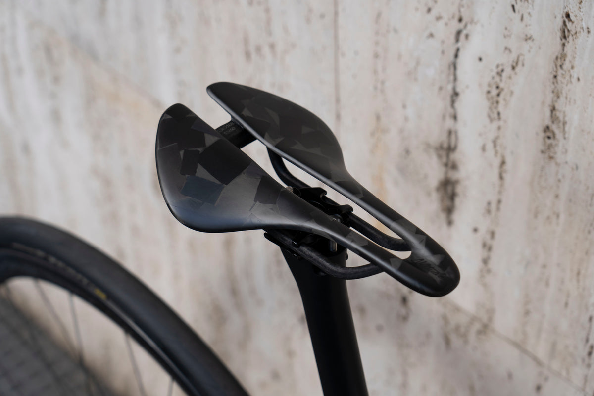 Racing saddle and dedicated integrated carbon seatpost setup on the De Rosa 70 complete bicycle by Cicli Corsa.