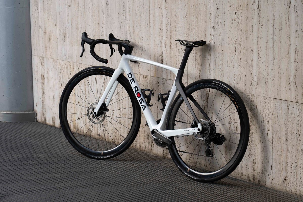 Non-drive side view of the De Rosa 70 premium white carbon complete road bicycle featuring Campagnolo Hyperon Ultra wheelset, assembled by Cicli Corsa.