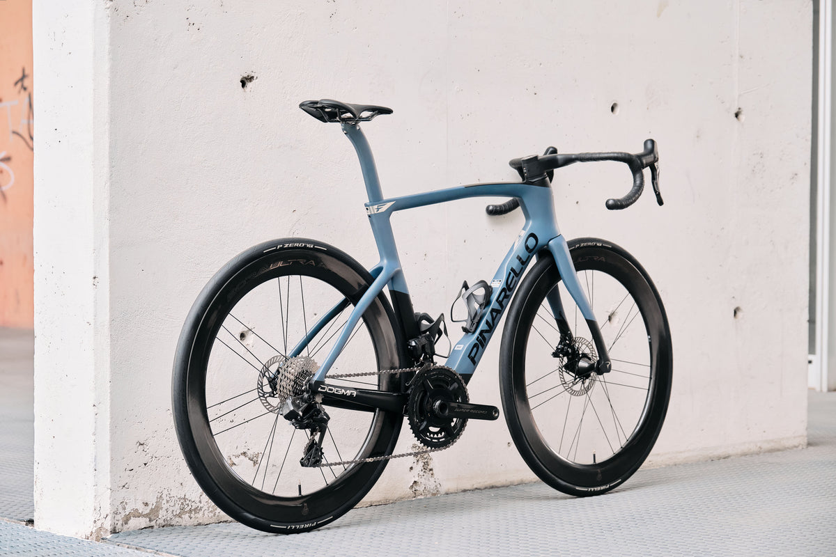 Rear view of the Pinarello Dogma F custom road complete bicycle highlighting the aerodynamic frame design and Bora Ultra WTO 60 Chrome wheelset, tailor-made by Cicli Corsa.