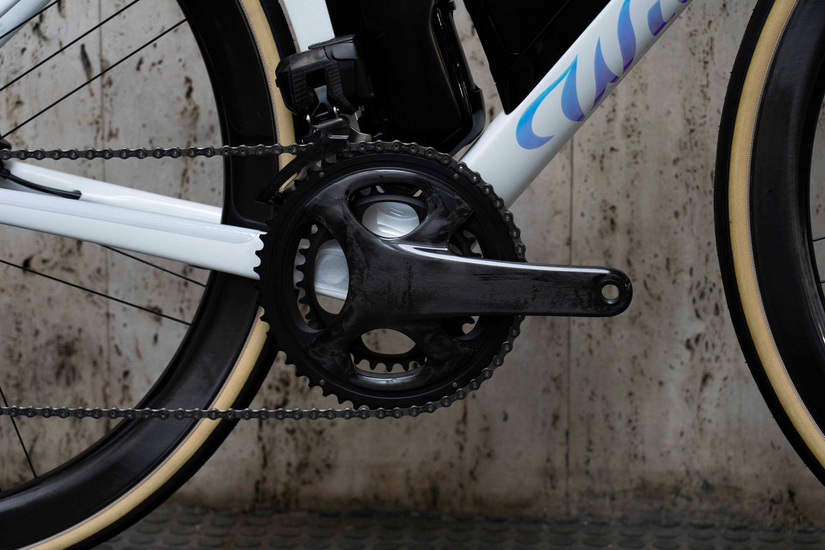 Campagnolo Super Record carbon road crankset close-up on the premium Wilier Filante SLR complete bicycle by Cicli Corsa.